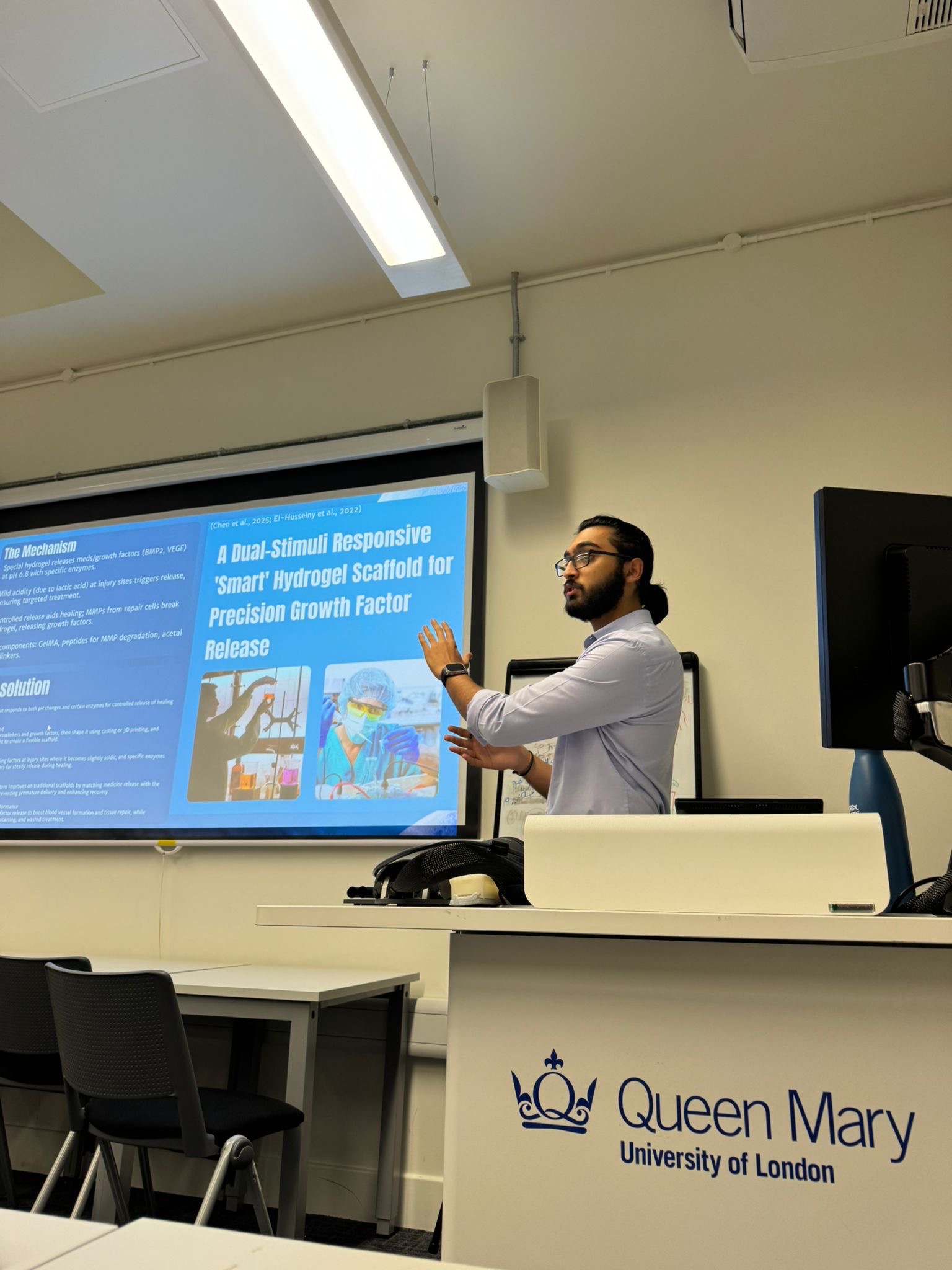 Madhav presenting at Queen Mary University of London